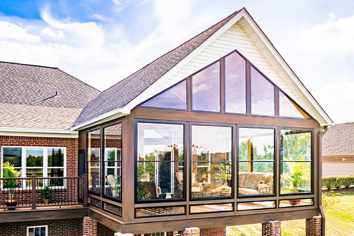 A beautiful, raised a-frame sunroom photographed on a sunny day